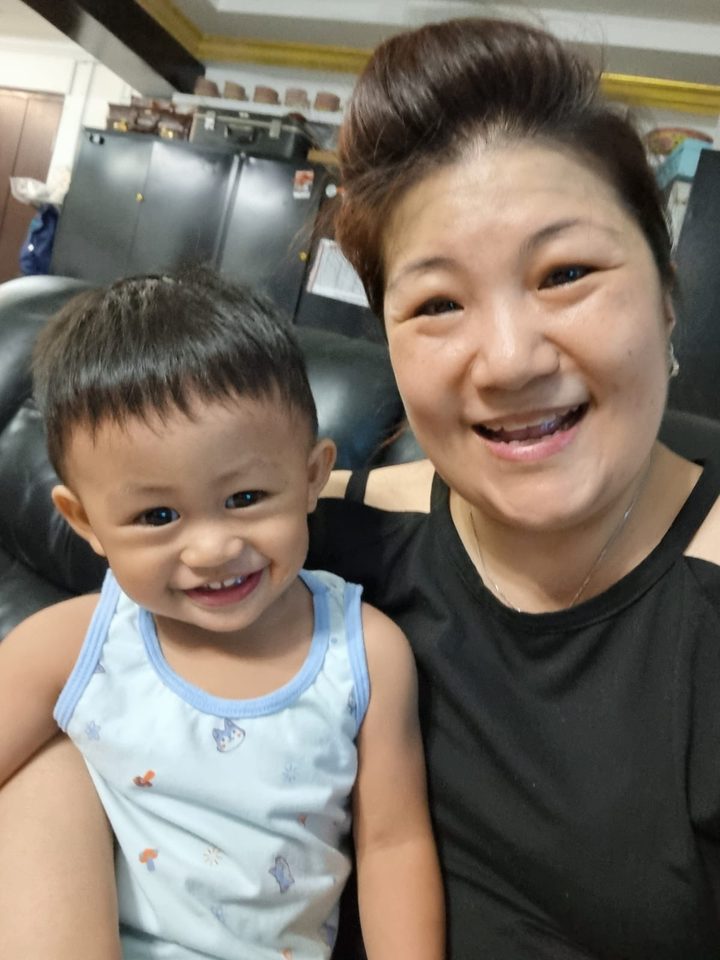 Happy little one in Aunty Jade's care
