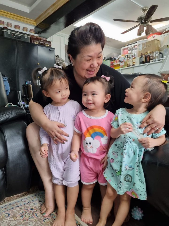 Happy little one in Aunty Jade's care