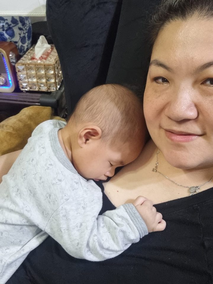 Happy little one in Aunty Jade's care